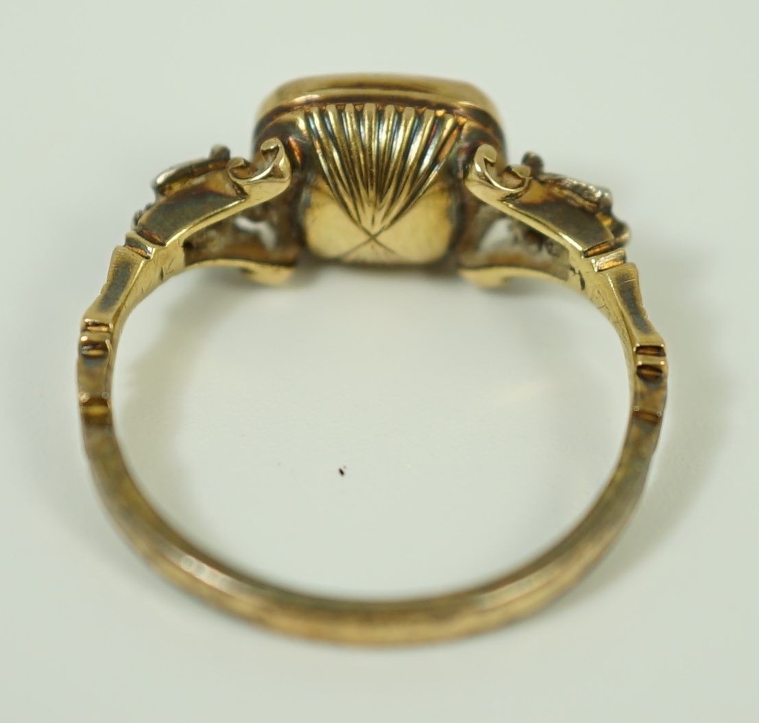 An 18th century gold and rock crystal and diamond set mourning ring